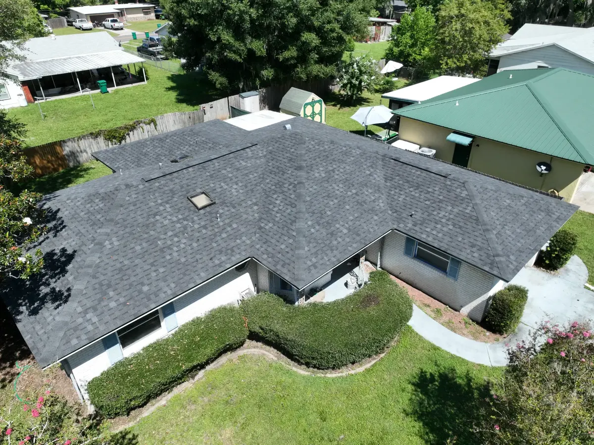 Completed charcoal shingle roof aerial overview, August 2024