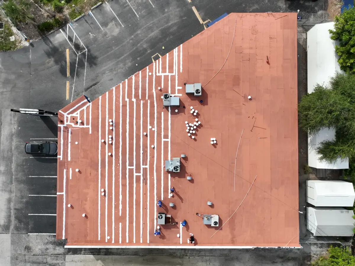 Low-slope commercial roof aerial view after completed installation, April 2024