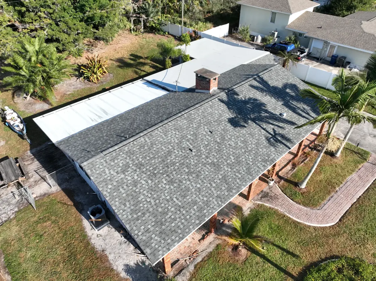 Post-maintenance aerial view of shingle and metal roof, November 2025