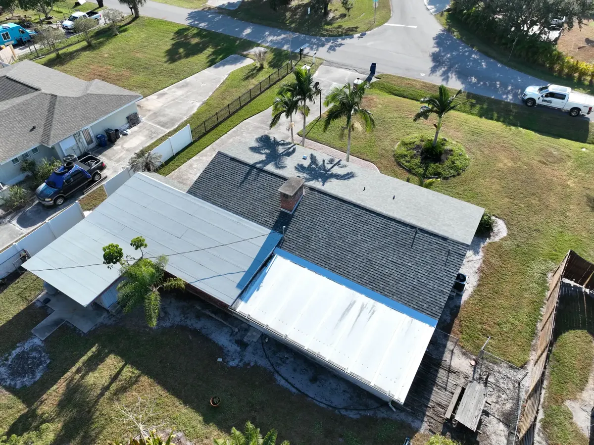 Aerial overview of a completed shingle and metal roof, 2025