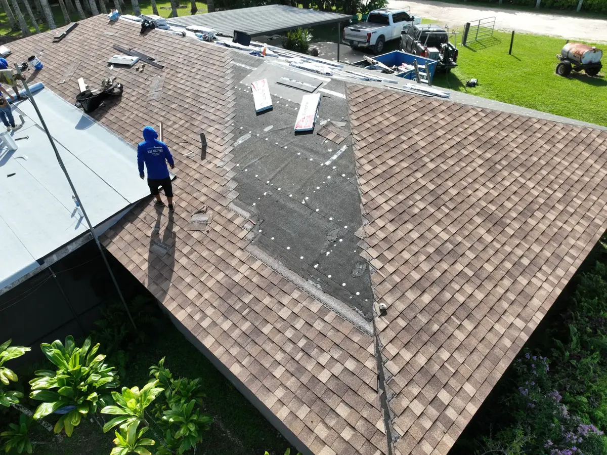Shingle teardown in progress, crew on roof, November 2024