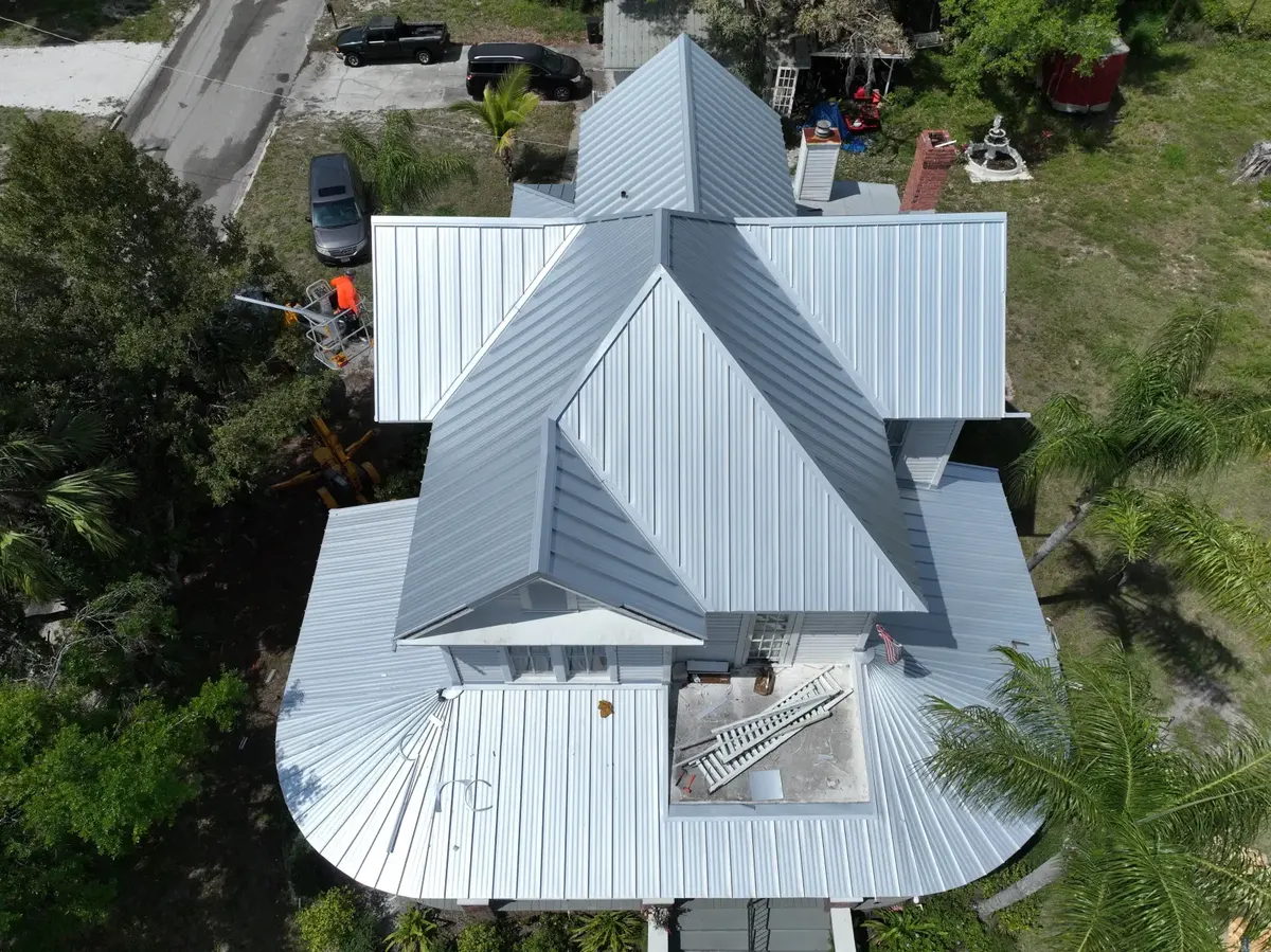 Standing seam metal roof ridge and eave detail, March 2024