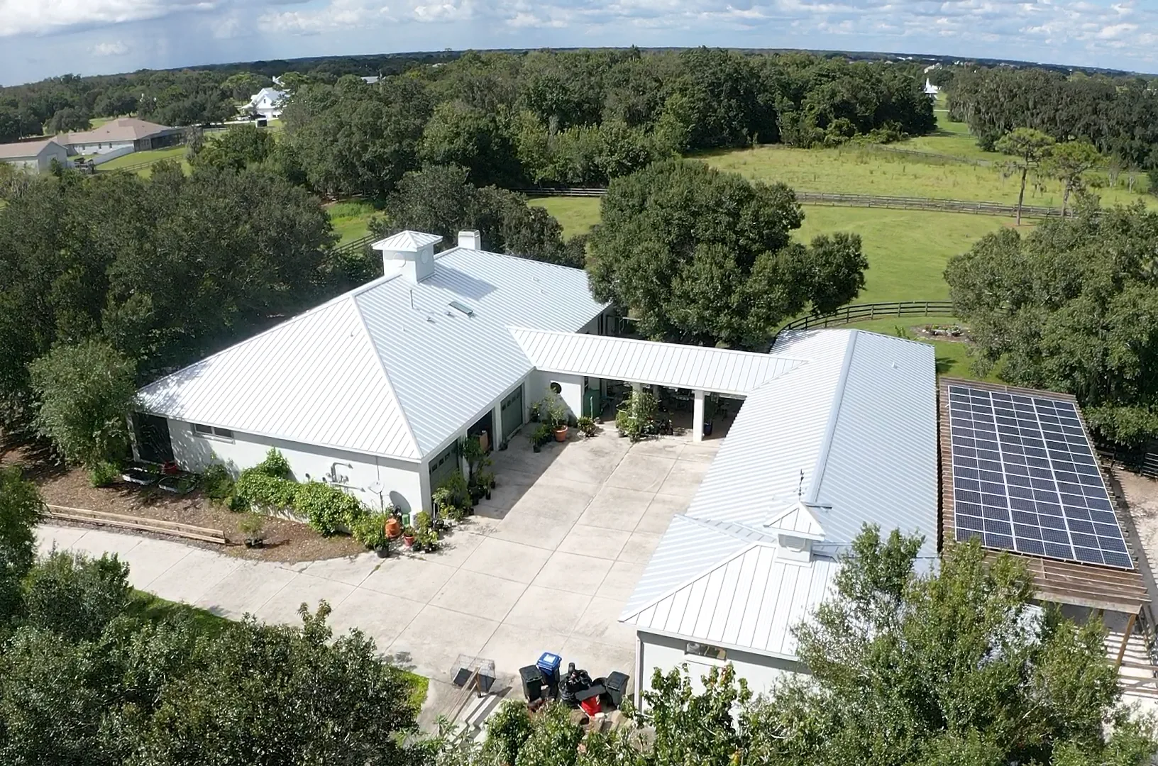 Metal roof on country estate, aerial view