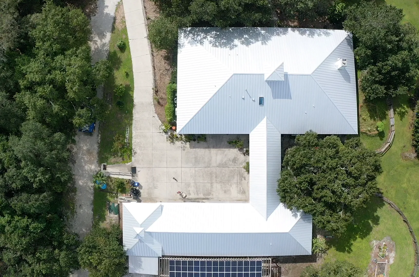 Metal roof with solar panels, aerial view